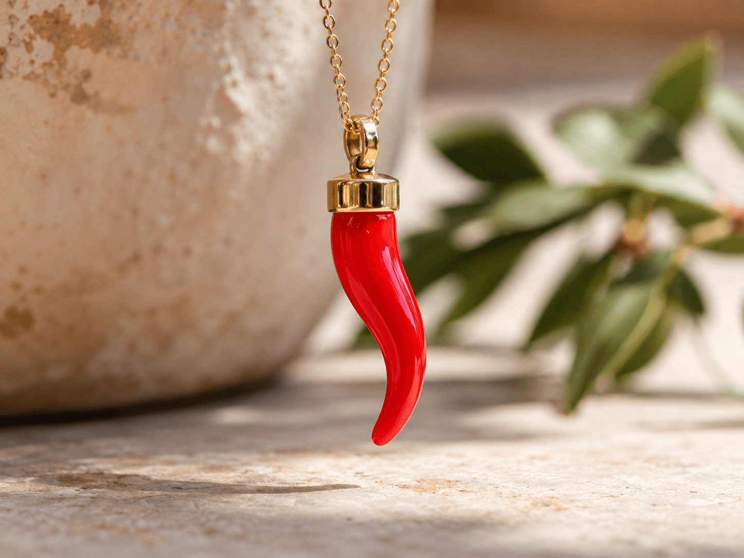 Red cornicello horn amulet worn as traditional protection from the evil eye