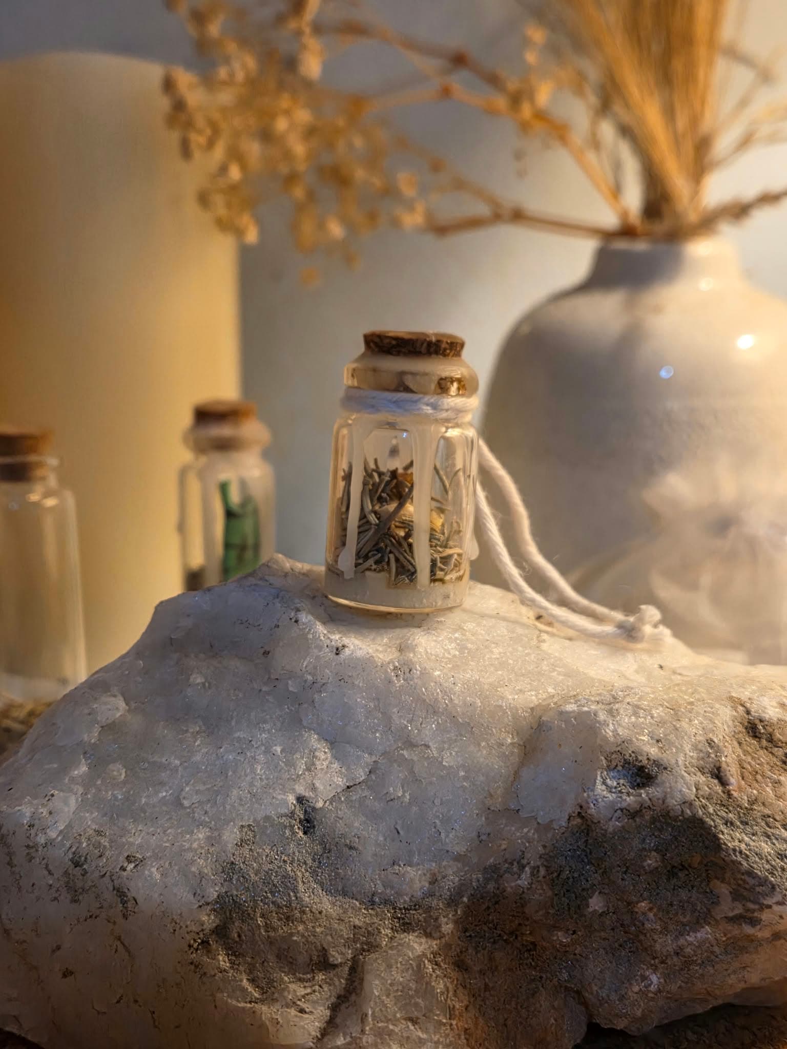 Handmade protection spell jar sealed with white candle wax