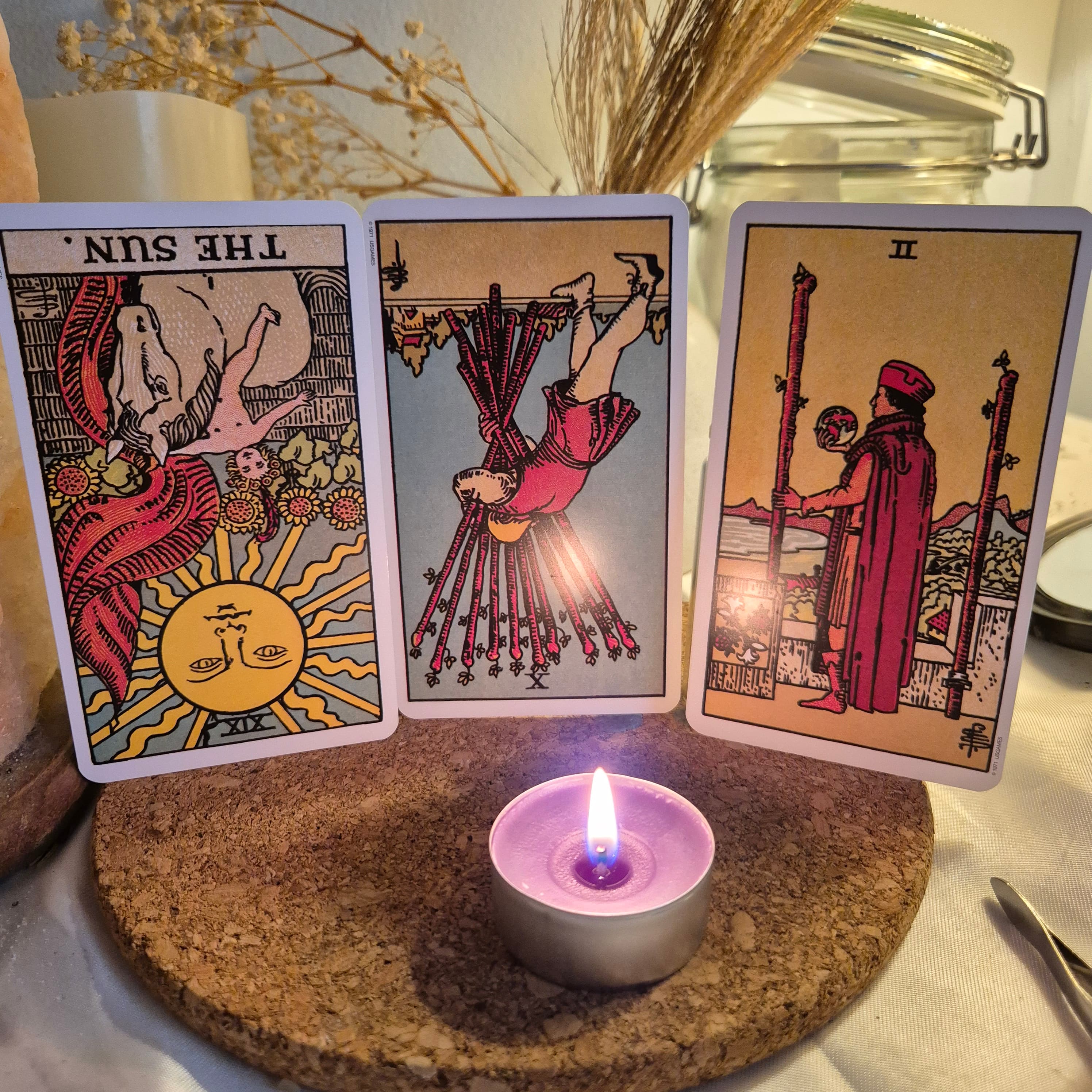 Three tarot cards laid out for a reading