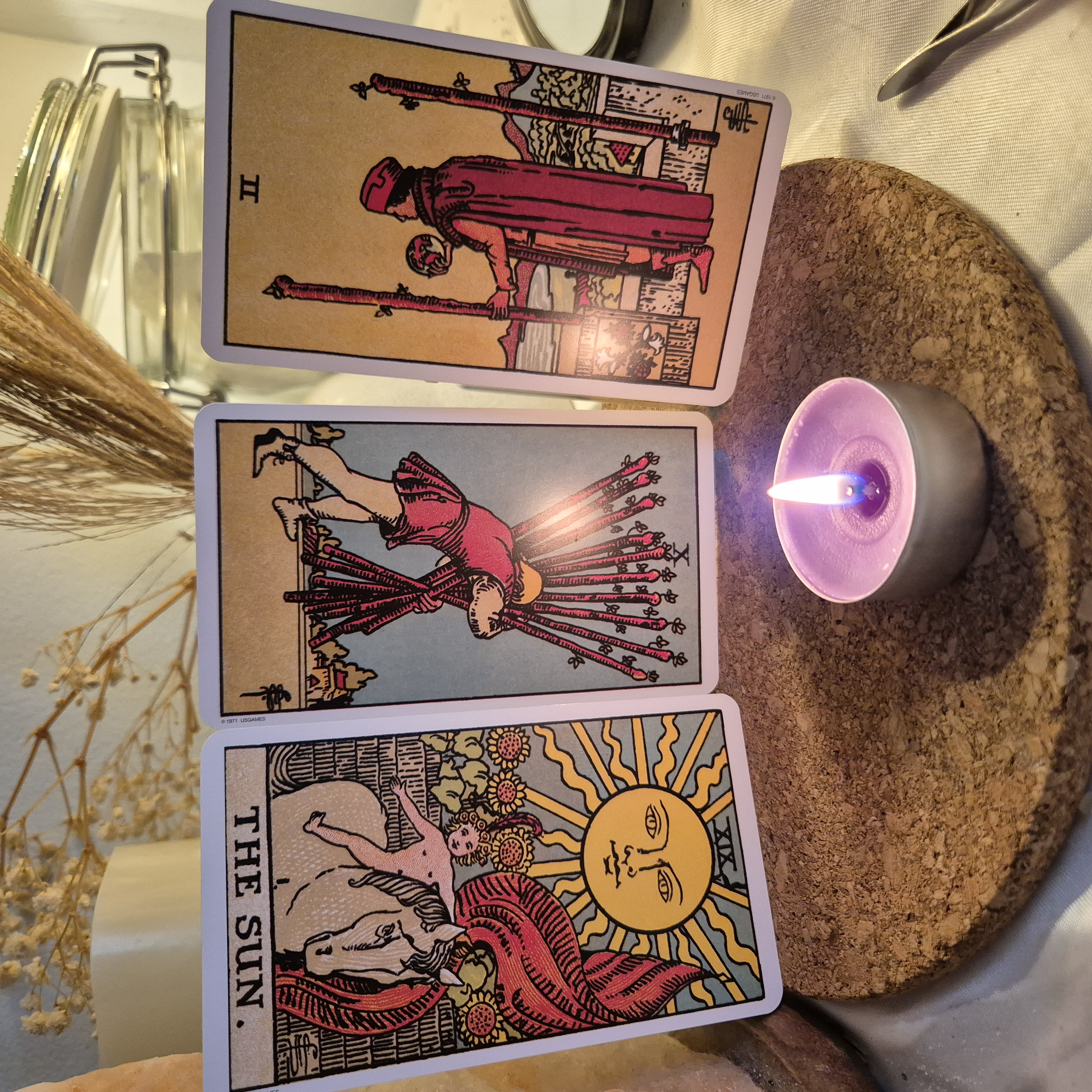 Three tarot cards laid out for a reading